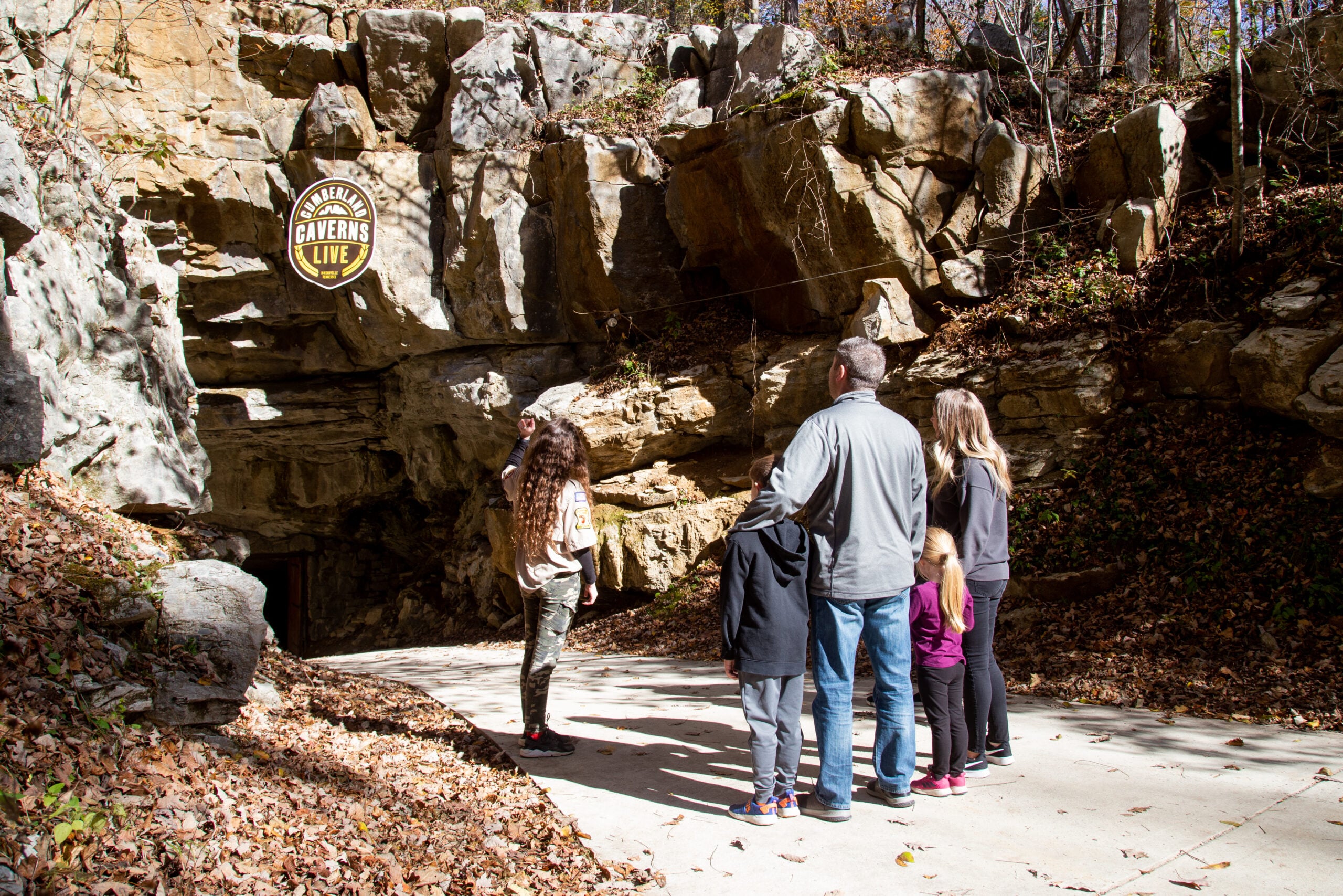 The illuminated limestone formations and wide walking paths inside the historic Cumberland Caverns.