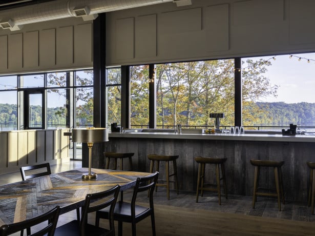 The modern dining room and large windows of the restaurant at The Lodge at Fall Creek Falls.